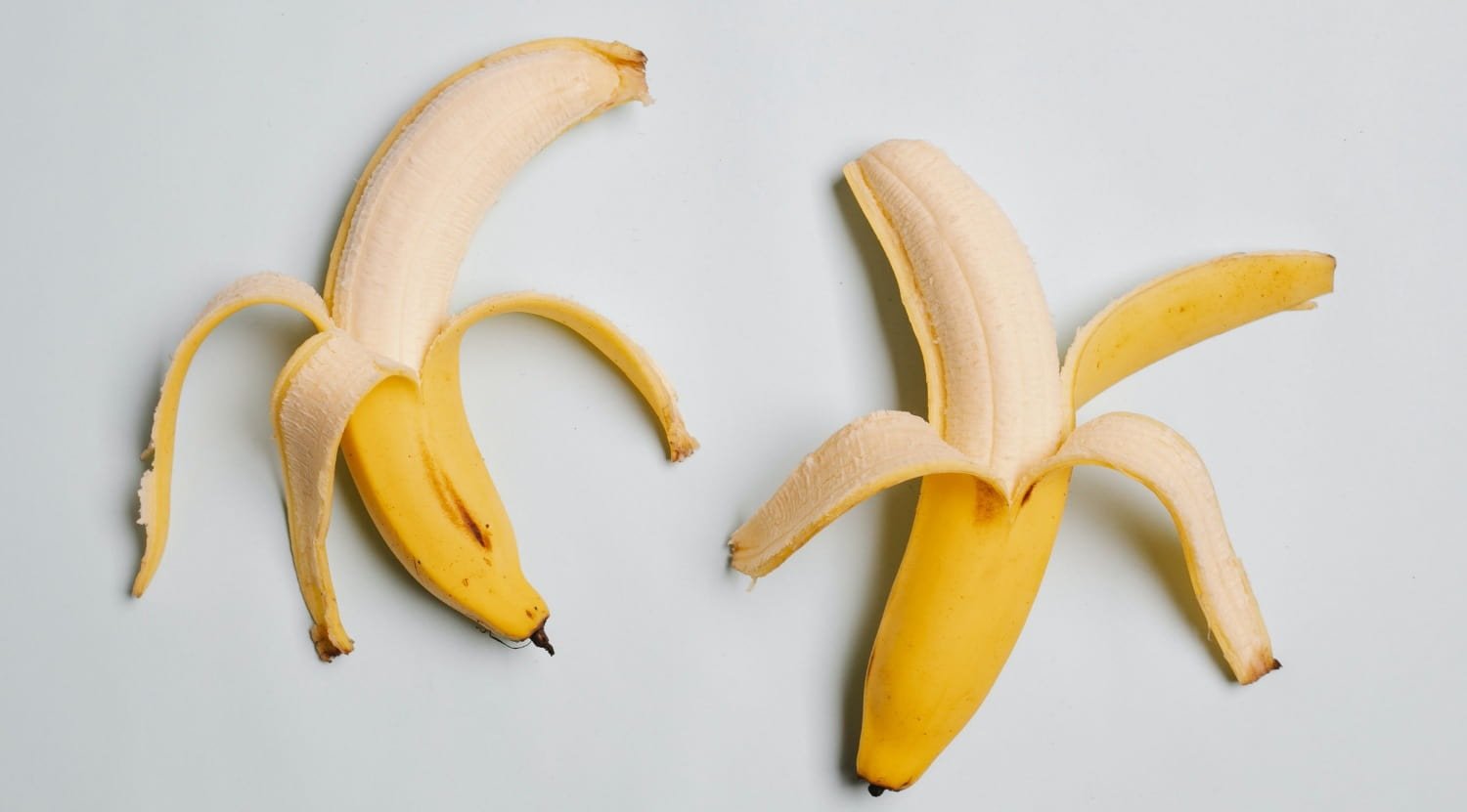Two ripe bananas are placed on the table
